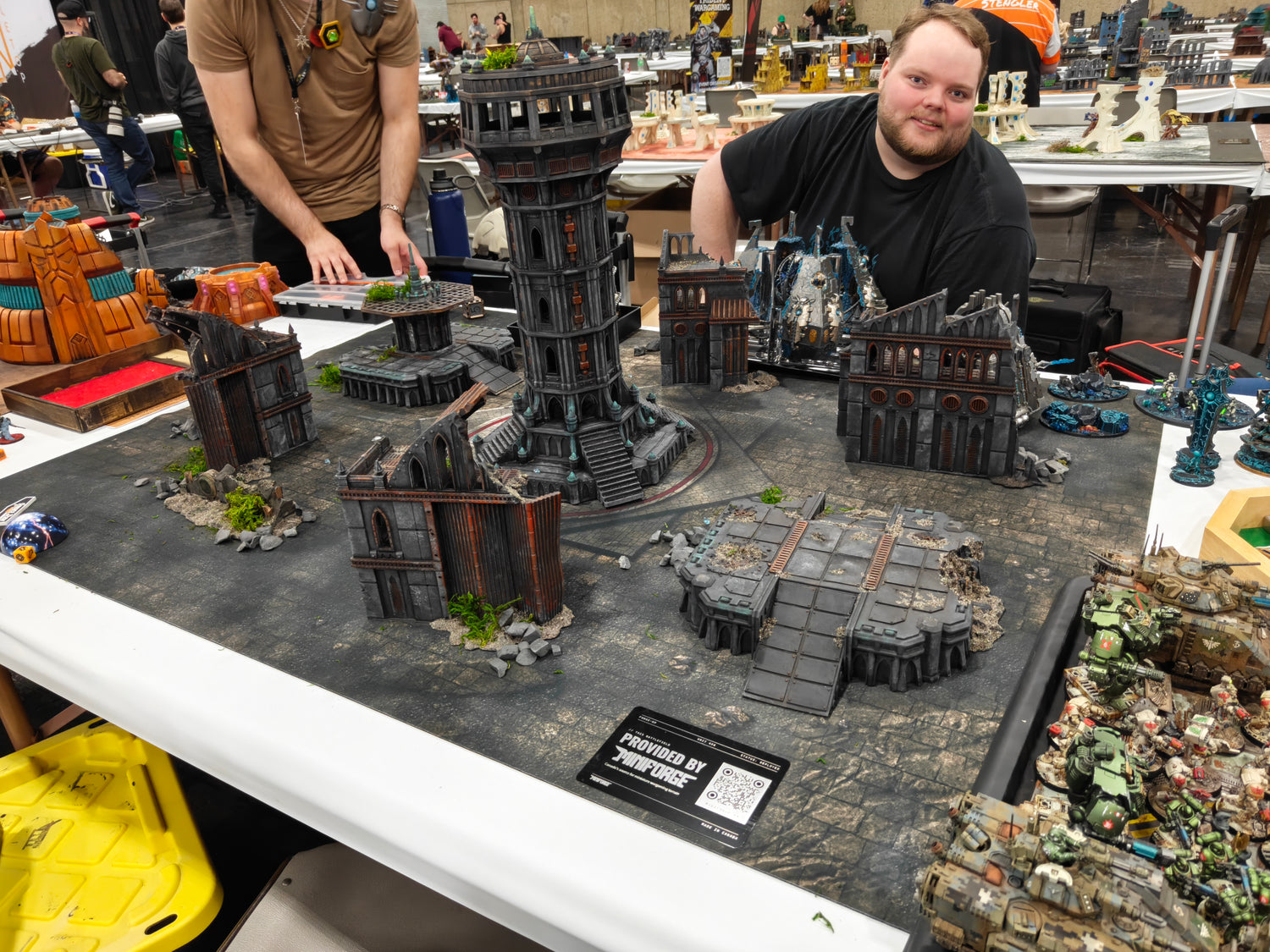 Tournament table with MiniForge 3D printed grimdark ruins terrain set at a Warhammer 40K gaming event